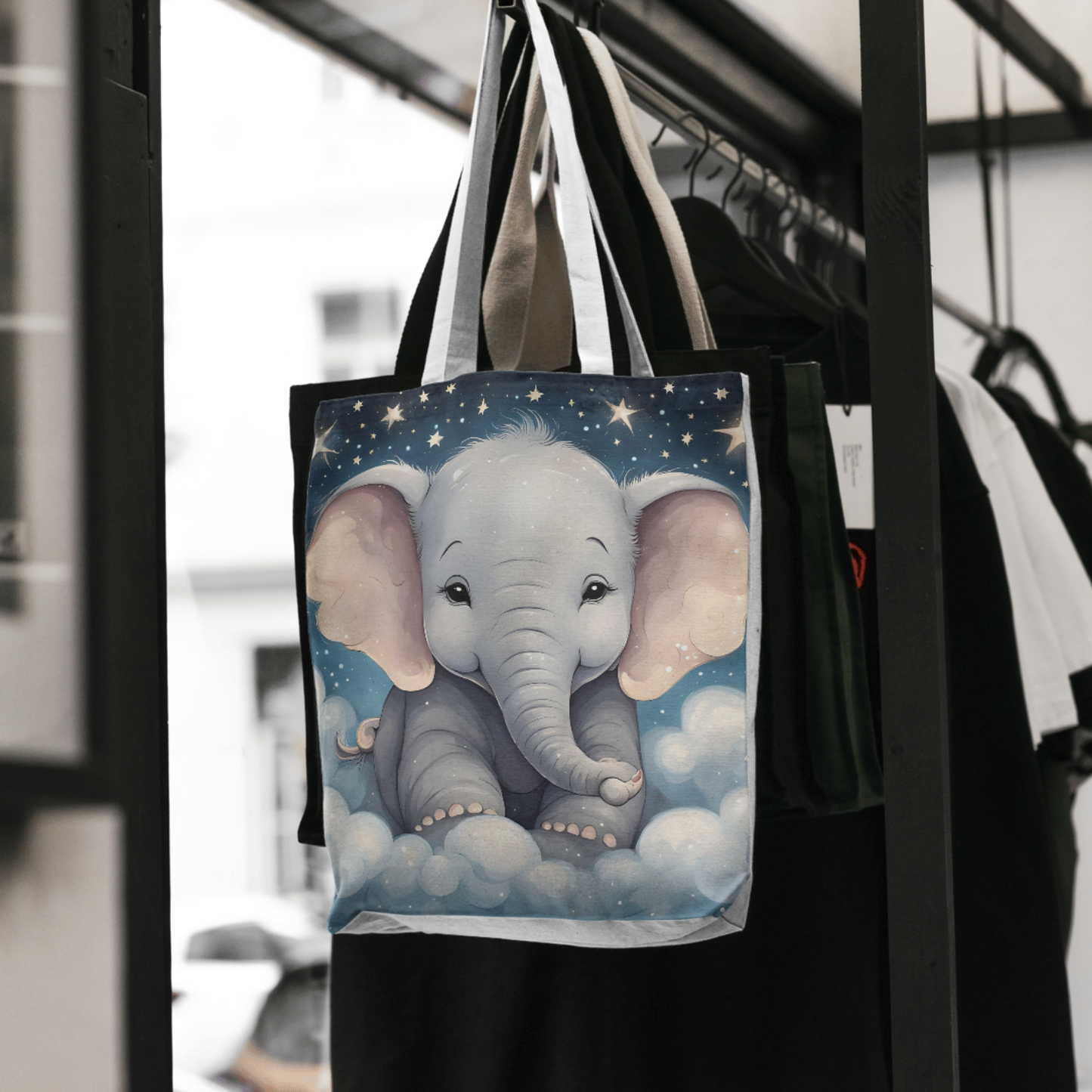 Magical baby elephant design with dreamy clouds and stars on a tote bag