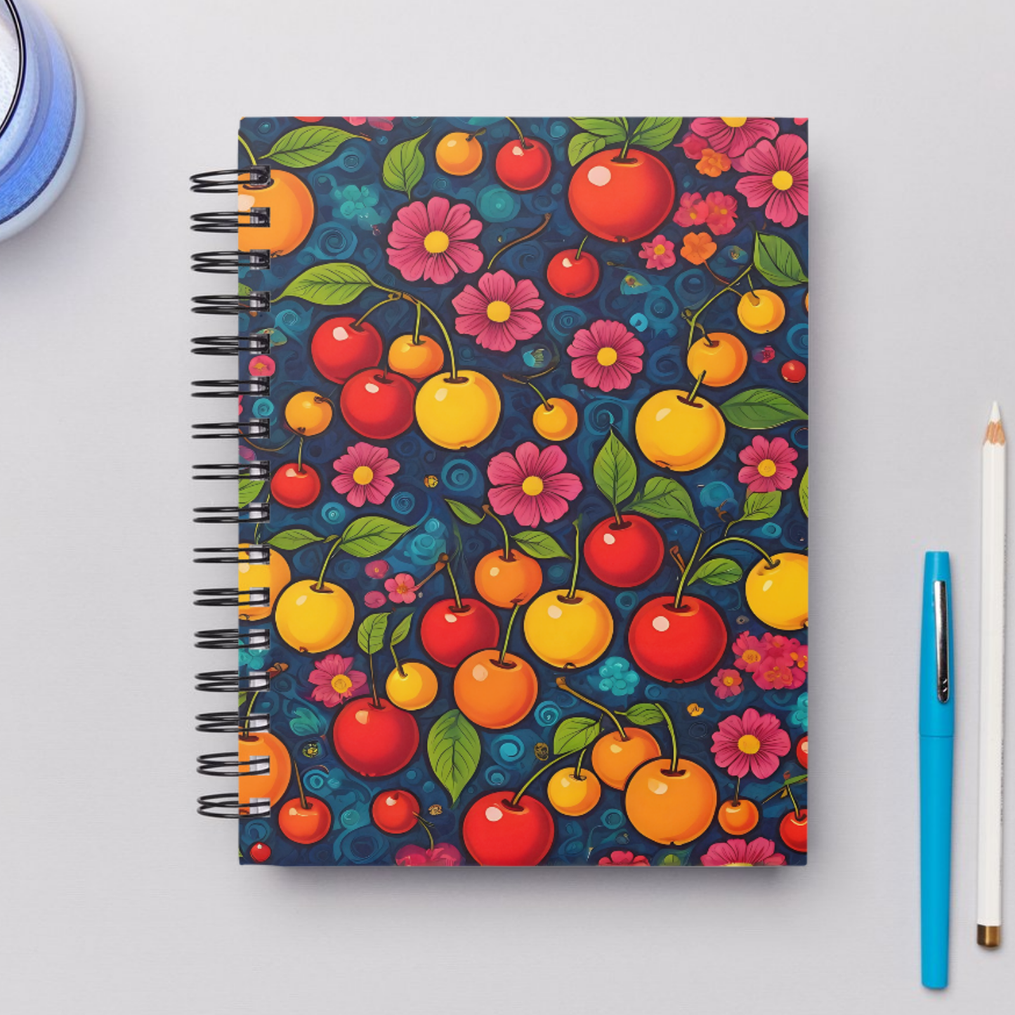 A stylish notebook cover adorned with a vibrant cherry and blossom pattern, ideal for journaling and note-taking