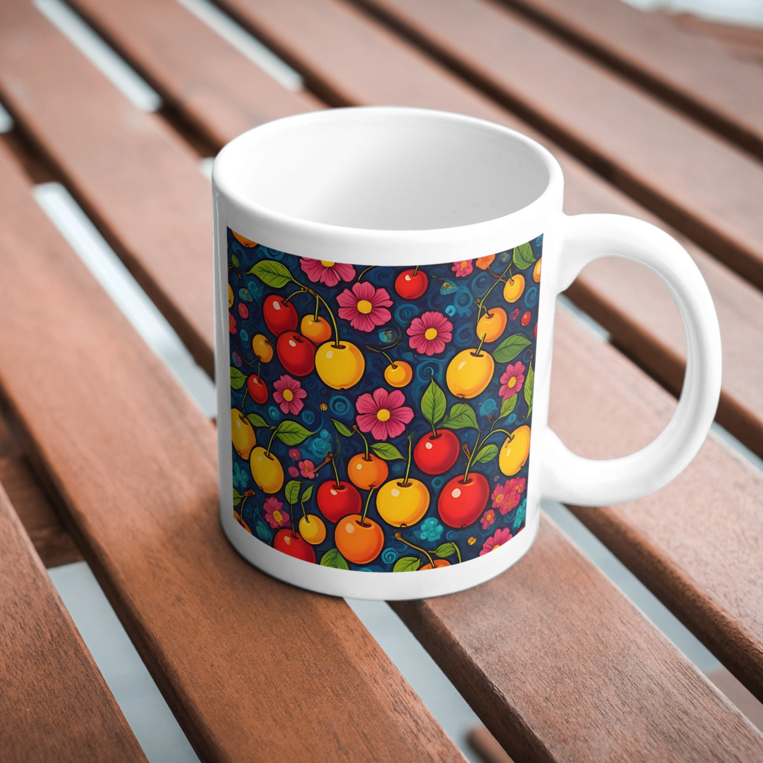 A ceramic mug featuring a seamless pattern of red cherries and pink flowers on a decorative blue background, perfect for coffee lovers.