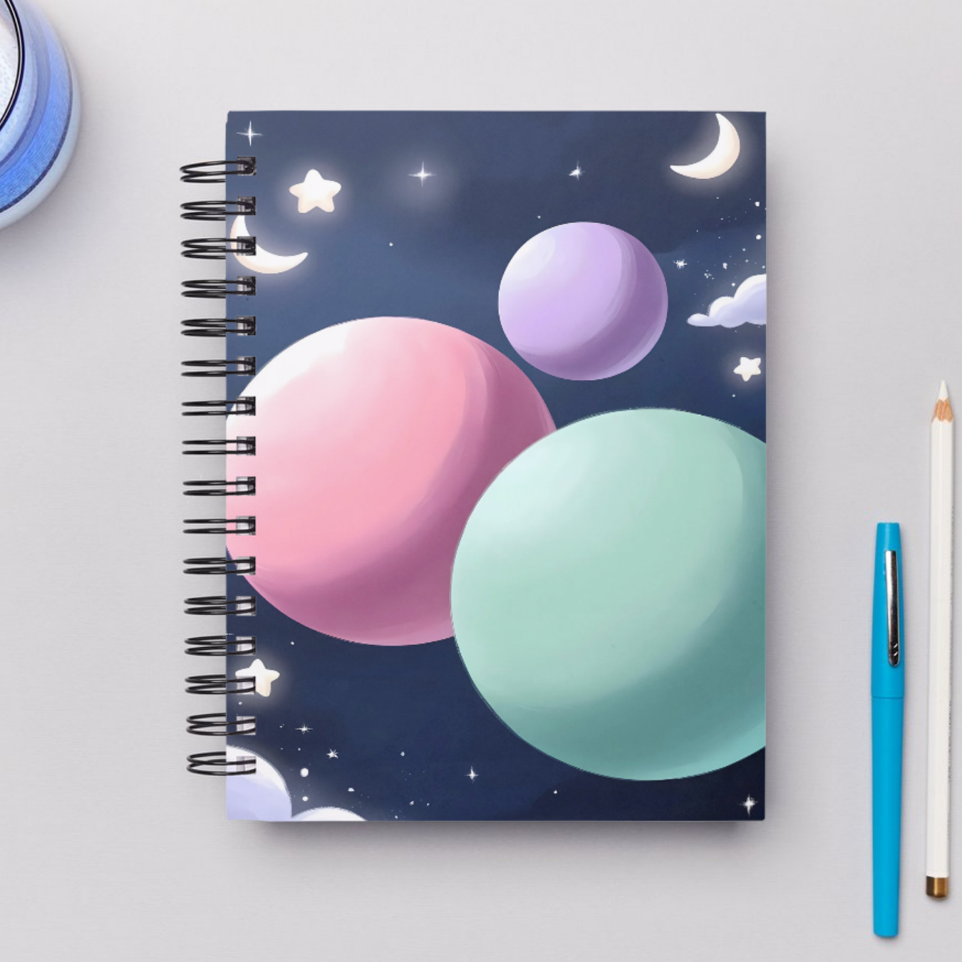 Whimsical Floating Pastel Planets Notebook with Soft Stars and Moons