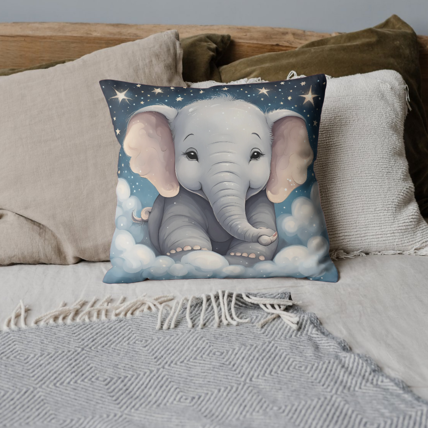 Sweet baby elephant in a night sky setting on a soft decorative pillow