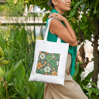 A woman wearing an reusable cotton tote bag featuring a stylish nature-inspired flower pattern, ideal for art and nature lovers